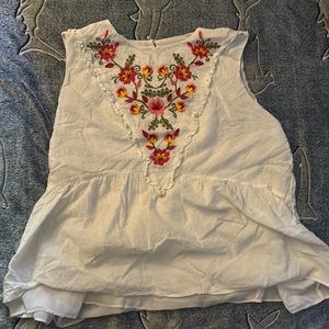 Floral embroidery with a white linen fabric